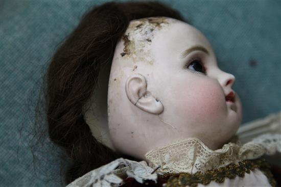 A Jumeau bisque head doll, stamped 7EJ, late 19th century, height 17.5in., small firing crack to right ear
